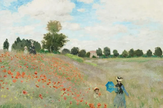 woman and daughter walking throgh a field of flowers