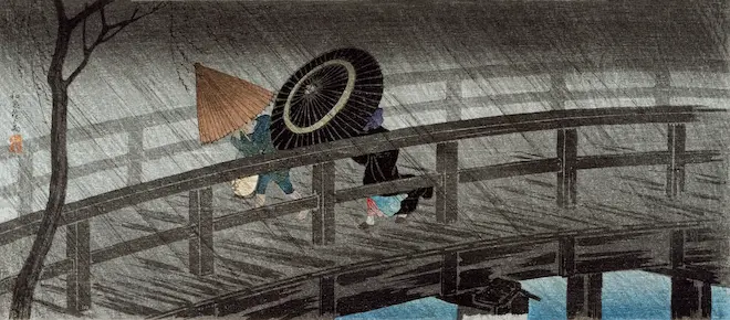 two figures crossing a bridge in a storm in 18th century Japan.