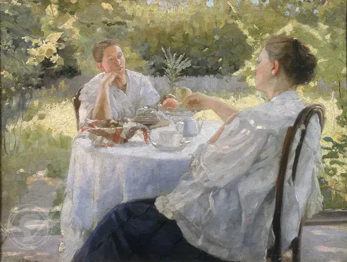 two women having tea and talking in a garden